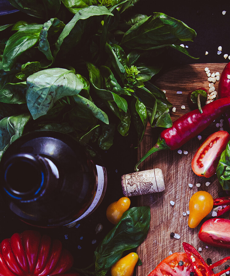 Fresh organic vegetables and ingredients on a kitchen table