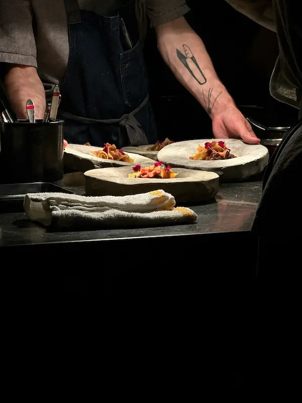 Michelin star chef carefully plating a gourmet dish